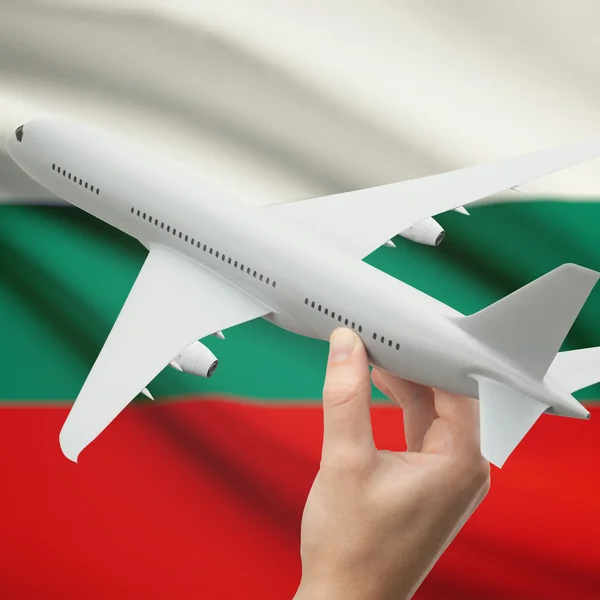 Airplane in hand with flag on background series - Bulgaria — Stock Photo, Image