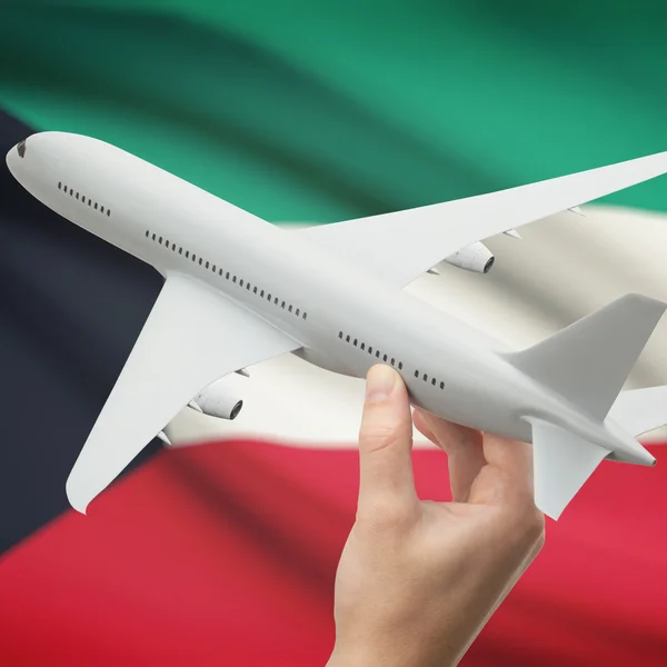 Aeroplano in mano con la bandierina sulla serie della priorità bassa - Kuwait — Foto Stock