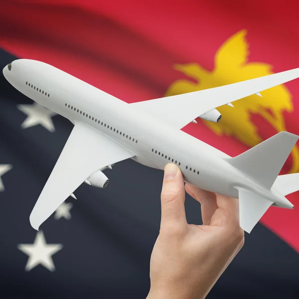 Avião na mão com a bandeira na série de fundo - Papua-Nova Guiné — Fotografia de Stock
