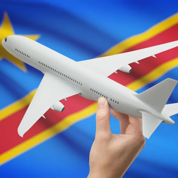 Vliegtuig in hand met vlag op achtergrond serie - Congo-Kinshasa — Stockfoto
