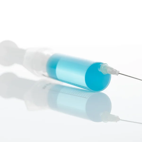 Close up of big syringe with medicine in it ready to be used for injection — Stock Photo, Image