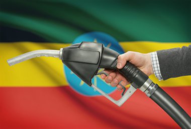 Pompa meme el ile arka plan - Etiyopya Ulusal bayrağını yakıt.