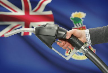 Pompa meme el ile arka plan - Cayman Adaları Ulusal bayrağını yakıt.