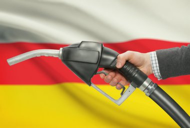 Pompa meme el ile arka plan - Güney Osetya Ulusal bayrağını yakıt.