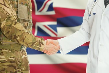 Military man in uniform and doctor shaking hands with US states flags on background - Hawaii