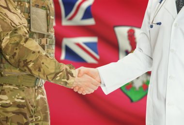 Military man in uniform and doctor shaking hands with national flag on background - Bermuda