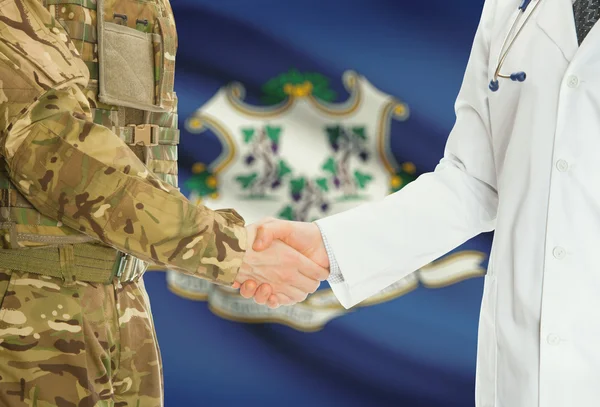 Military man in uniform and doctor shaking hands with US states flags on background - Connecticut — 图库照片