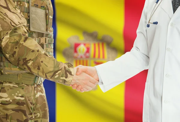 Military man in uniform and doctor shaking hands with national flag on background - Andorra — 图库照片