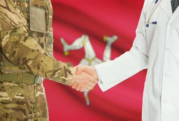 Military man in uniform and doctor shaking hands with national flag on background - Isle of Man — Stok fotoğraf