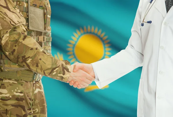 Military man in uniform and doctor shaking hands with national flag on background - Kazakhstan — Foto de Stock