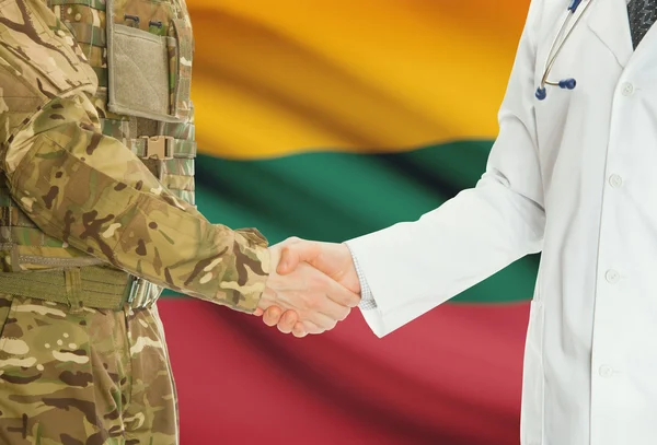 Military man in uniform and doctor shaking hands with national flag on background - Lithuania — Stock Photo, Image