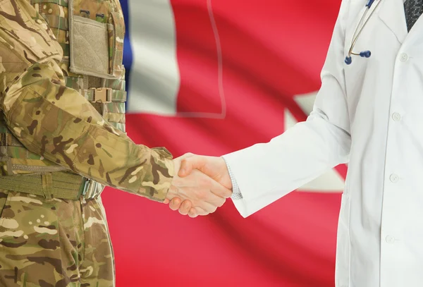 Military man in uniform and doctor shaking hands with national flag on background - Wallis and Futuna — Stock fotografie