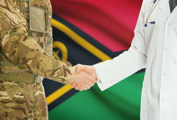 Military man in uniform and doctor shaking hands with national flag on background - Vanuatu — Stock Photo, Image