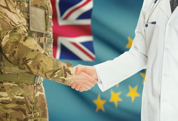 Military man in uniform and doctor shaking hands with national flag on background - Tuvalu — Φωτογραφία Αρχείου