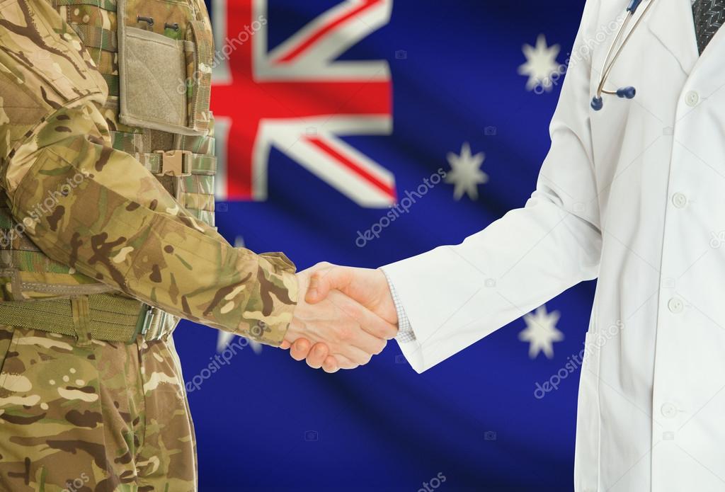 Military man in uniform and doctor shaking hands with national flag on background - Australia