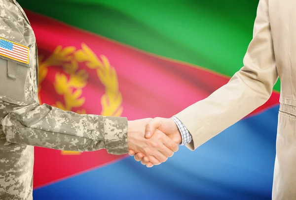 USA military man in uniform and civil man in suit shaking hands with national flag on background - Eritrea — Stock Photo, Image