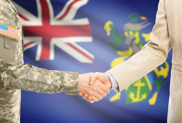 USA military man in uniform and civil man in suit shaking hands with national flag on background - Pitcairn Islands —  Fotos de Stock