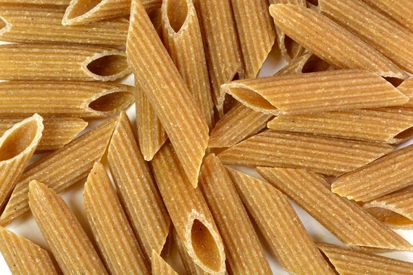 Volkoren tarwemeel penne rigate pasta Rechtenvrije Stockafbeeldingen