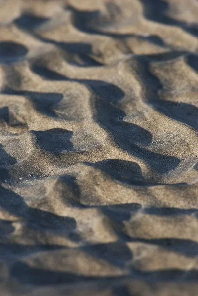 Fechar de padrão de areia de uma praia — Fotografia de Stock