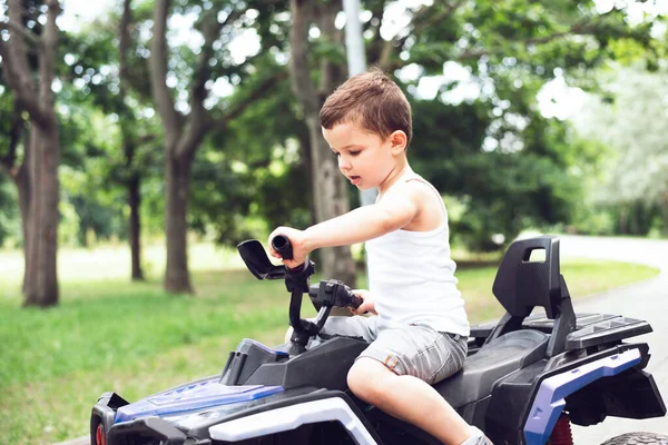 Cute Five Year Old Boy Rides Black Purple Atv Quad — ストック写真