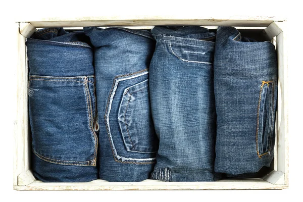 Blå Jeans över trä bakgrund — Stockfoto