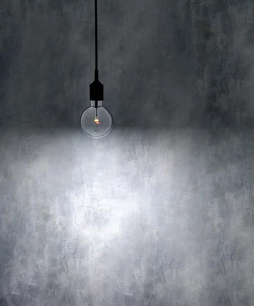 Old grunge wall with bulb light — Stock Photo, Image