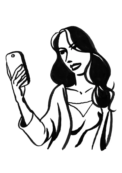 Pige holder en mobiltelefon - Stock-foto