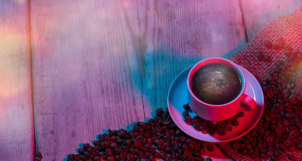 Coffee on table with colorful lights