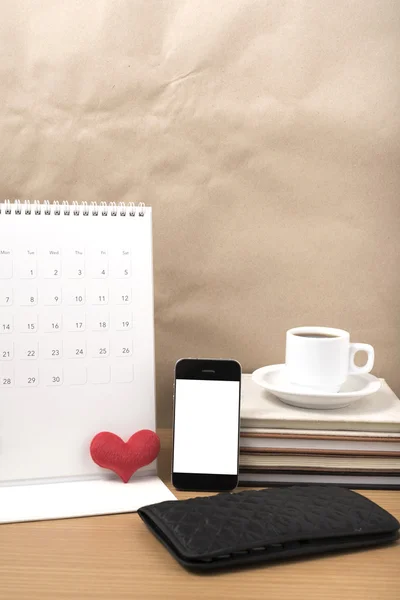 office desk : coffee with phone,wallet,calendar,heart,stack of b