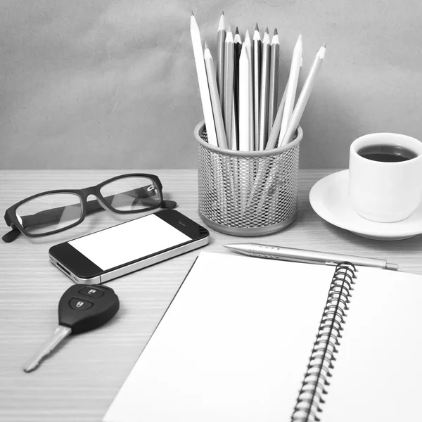 office desk : coffee and phone with key,eyeglasses,notepad,penci
