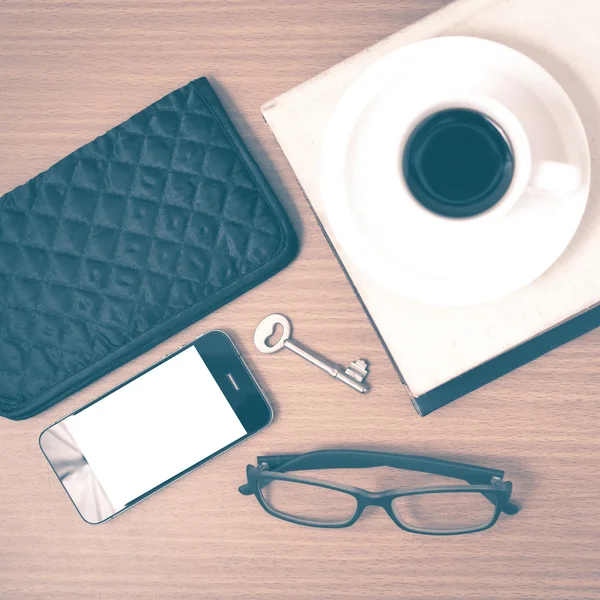 Coffee and phone with stack of book,key,eyeglasses and wallet vi — Stock Photo, Image