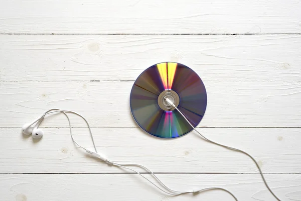 Vista superior del disco DVD y auriculares — Foto de Stock