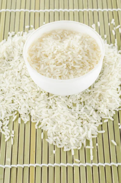 Uncooked rice in mini bowl — Stock Photo, Image