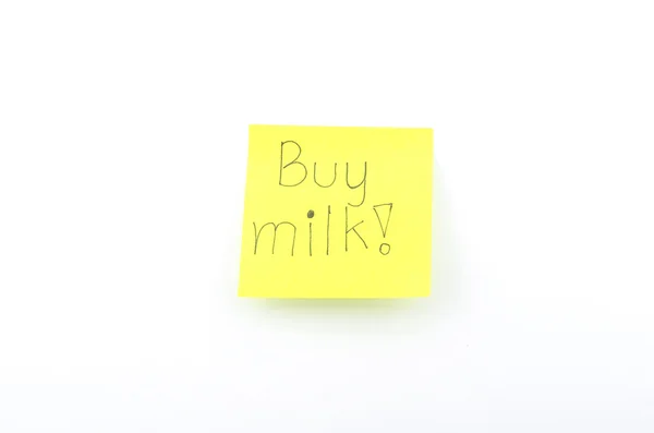 Comprar texto de la leche en amarillo post it —  Fotos de Stock