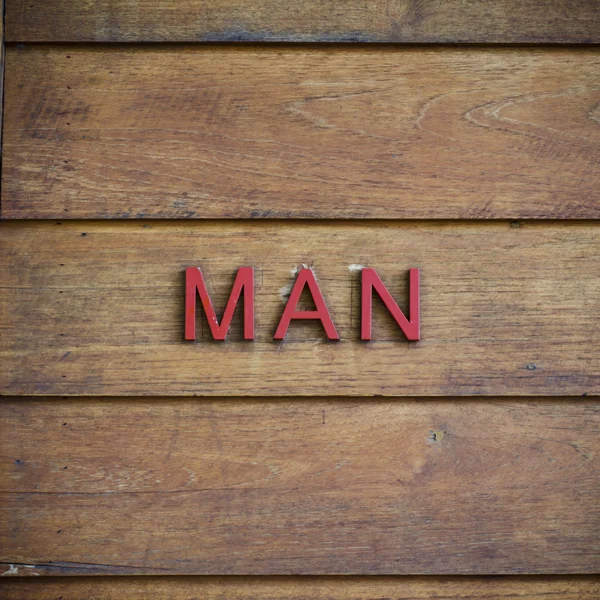 Man toilet symbolic on wood background — Stock Photo, Image