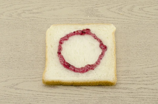 Jam alphabet on sliced bread — Stock Photo, Image