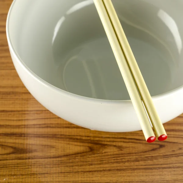 Empty white bowl with chopstick — Stock Photo, Image