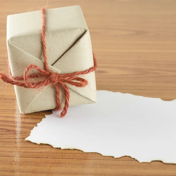 Gift box with paper — Stock Photo, Image