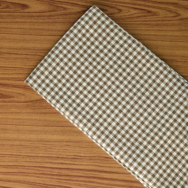 Kitchen towel on wood background — Stock Photo, Image