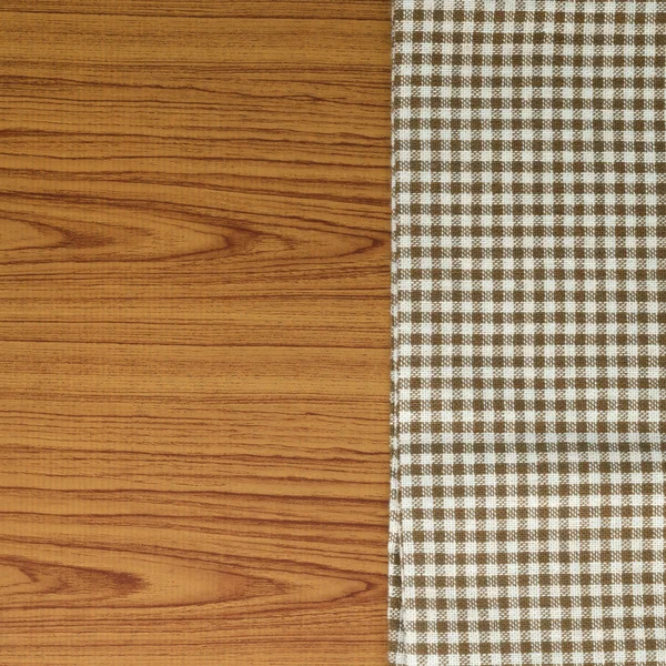 Kitchen towel on wood background — Stock Photo, Image