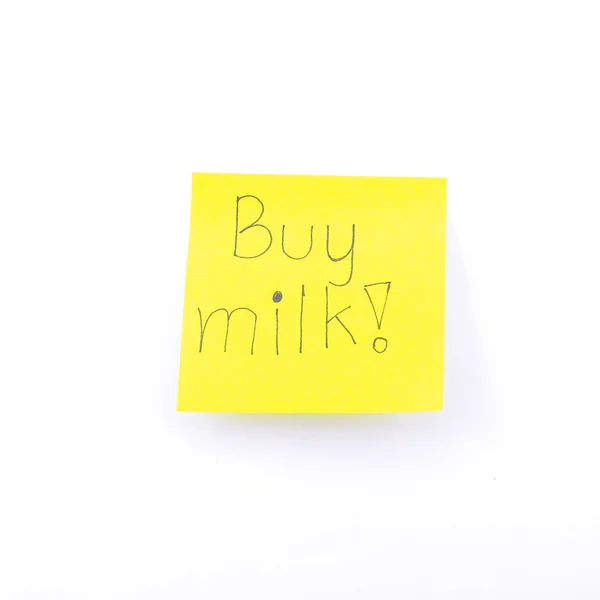 Comprar texto de la leche en amarillo post it —  Fotos de Stock