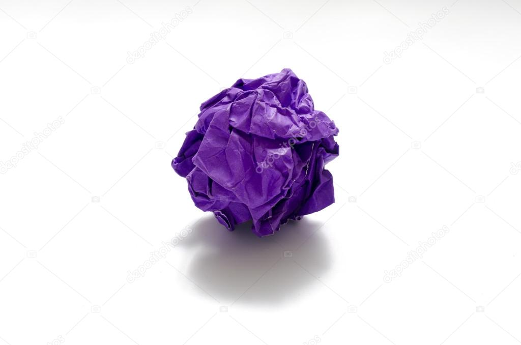 color crumpled paper ball on a white