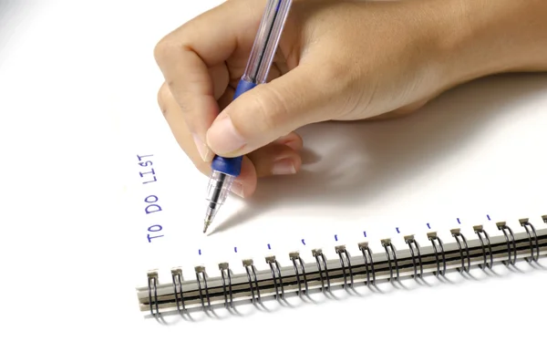 Woman hand writing with pen on notebook — Stock Photo, Image