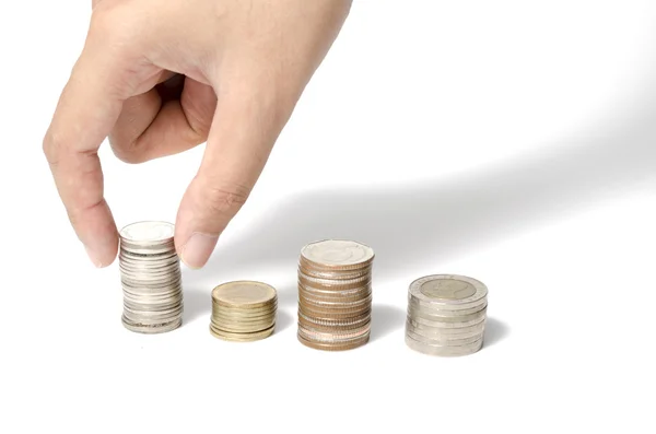 Hand putting stack of coins — Stock Photo, Image