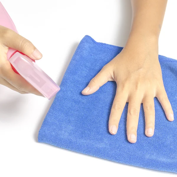 Hand cleaning with spray bottle and blue rag — Stock Photo, Image