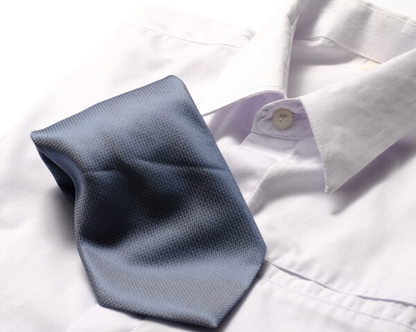 white shirt with blue tie
