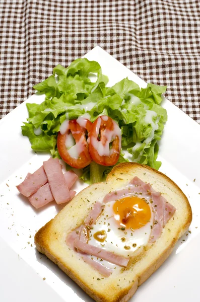 Breakfast egg in a hole — Stock Photo, Image