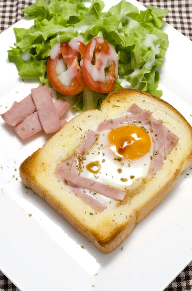 Breakfast egg in a hole — Stock Photo, Image