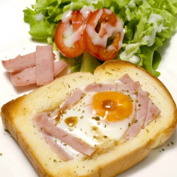 Breakfast egg in a hole — Stock Photo, Image