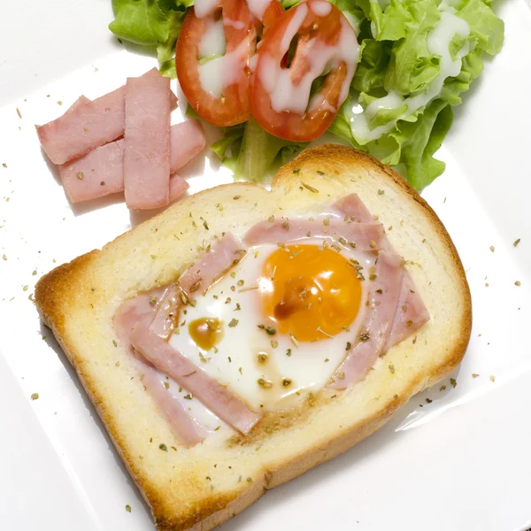 Breakfast egg in a hole — Stock Photo, Image